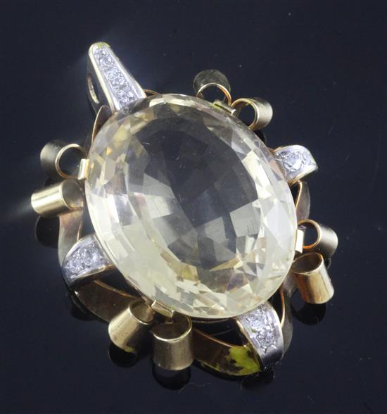 A 1940s/1950s 18ct gold mounted citrine and diamond set oval pendant, 5cm.